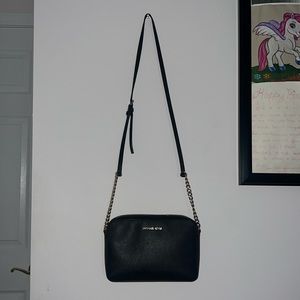 Black and gold Micheal Kors purse